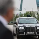 Putin is accompanied by a car with a ZU-23 anti-aircraft gun platform
