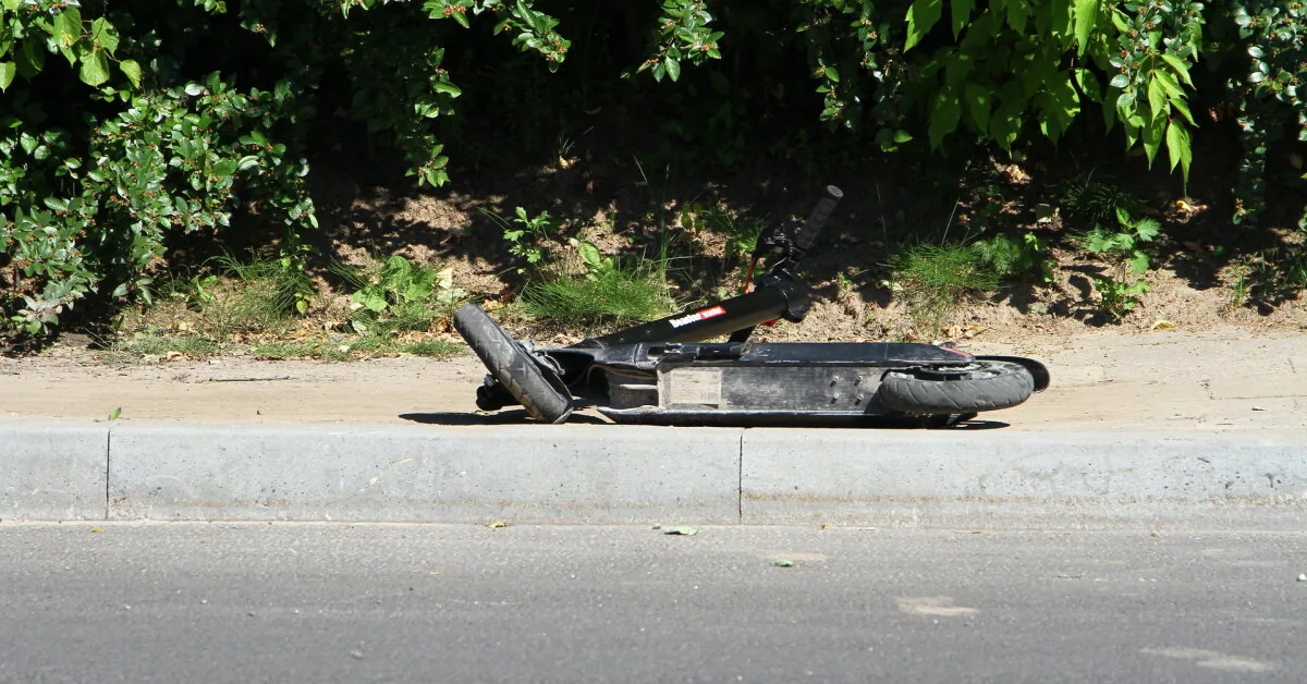 In Vilnius, a car hit a man riding a scooter across a pedestrian crossing