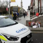 A woman wanted in Lithuania for sexual crimes against a child was found hiding in a wardrobe in the United Kingdom