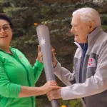 President Adamkus lighting the symbolic torch: "Olympic values strengthen society"