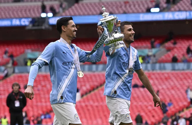 Reuters/Scanpix photo/Rodri and Tijjani Reijnders with the FA Cup