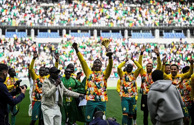 AFP photo/Senegalese footballers with the African Champions Cup
