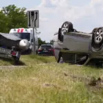 An SUV with a boat overturned in Panevėžys district