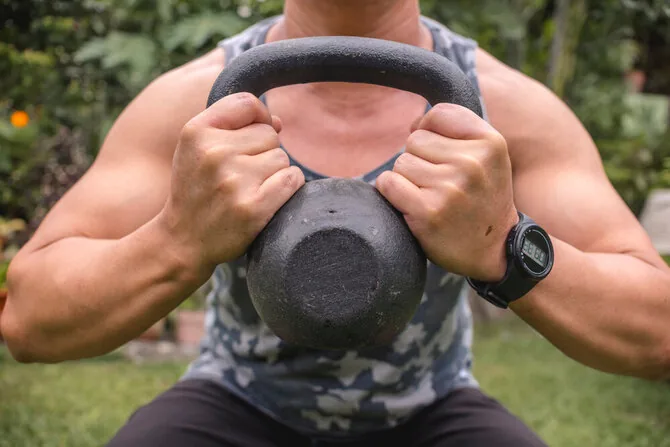 Shutterstock photo/Squat with a dumbbell