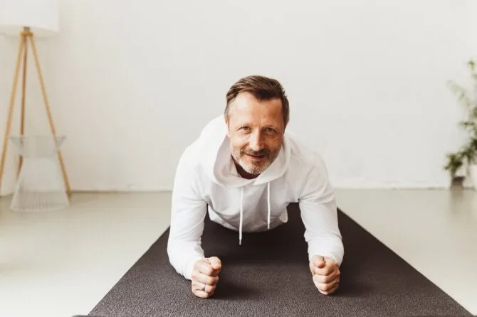 Shutterstock photo/Man doing Forearm Plank exercise