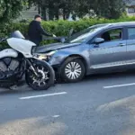 Collision between a Citroen car and a Victory motorcycle