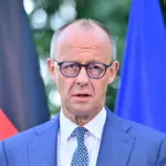 German Chancellor reshuffles government to curb far-right influence
