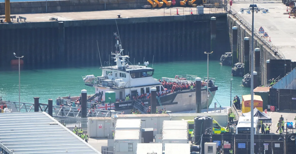A boat with 128 migrants has reached England, media reports