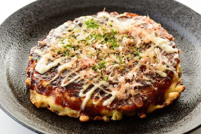 iStock photo/Japanese fresh cabbage pancakes Okonomiyaki