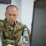 Ukrainian soldiers and civilians welcome new military commander