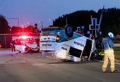 During the accident, the police car overturned onto its roof