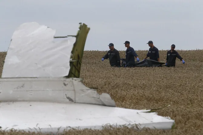 Maxim Zmeyev / Reuters. /Consequences of the downed Malaysia Airlines plane