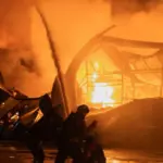 A nighttime Russian drone attack in Sumy damaged a shopping center and an apartment building