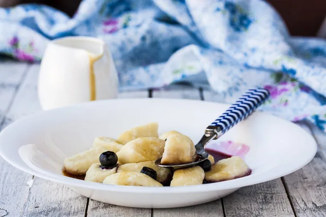 Shutterstock photo/Dumplings with blueberry and curd filling
