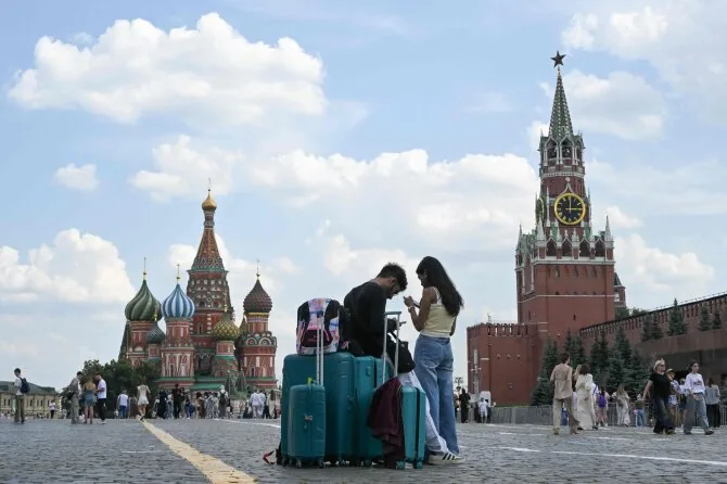 AFP/"Scanpix" photo/Tourists in Moscow