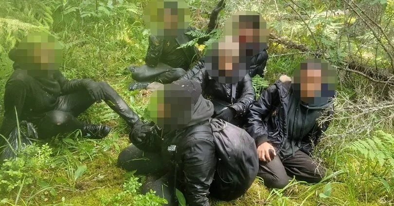 Lithuanian officers helped detain 55 migrants in a neighboring country
