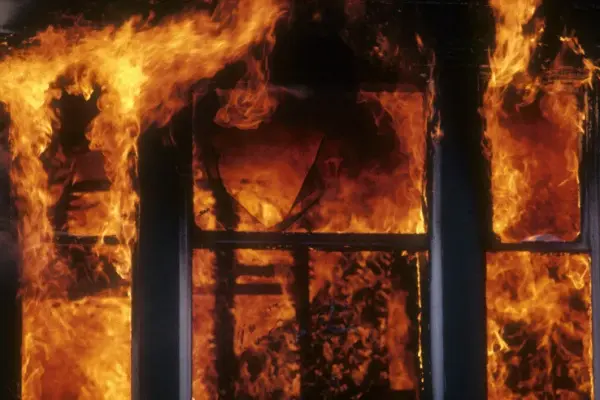 A residential house was on fire: windows cracked from the heat, had to dig through the ashes