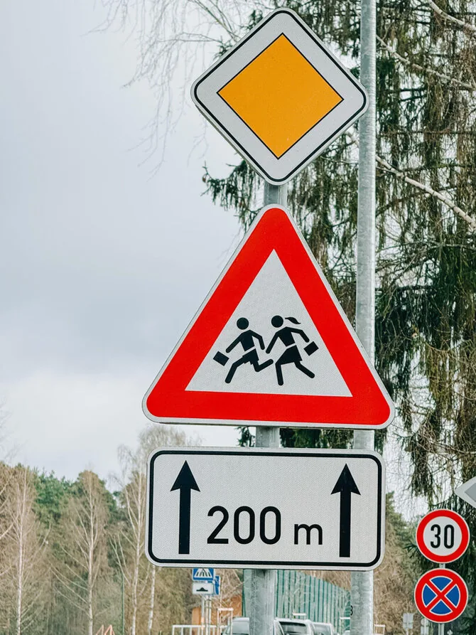 School traffic sign in Latvia / Emils Vanags / Alamy
