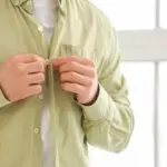 Why are buttons on men's and women's clothes on different sides?