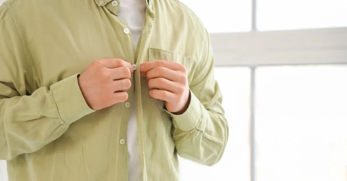Why are buttons on men's and women's clothes on different sides?