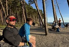 People watch the solar eclipse at the seaside.