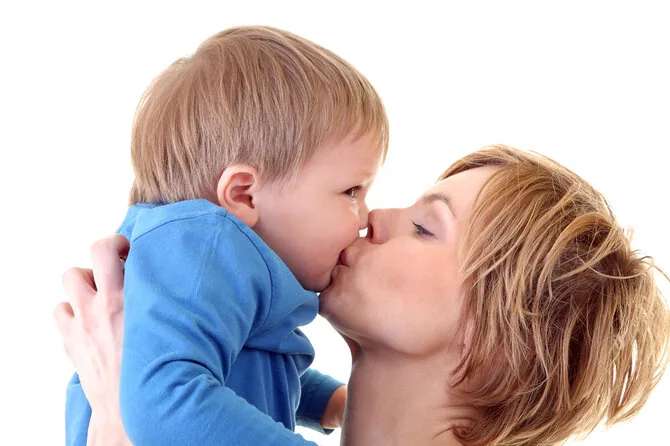Shutterstock photo/Mother kisses child