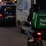 An unusual sight was captured in Vingis Park: empty bottles pulled out of a container in a "Bolt Food" backpack