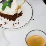 Perfect dessert: moist brownie with a fluffy curd layer and blueberries