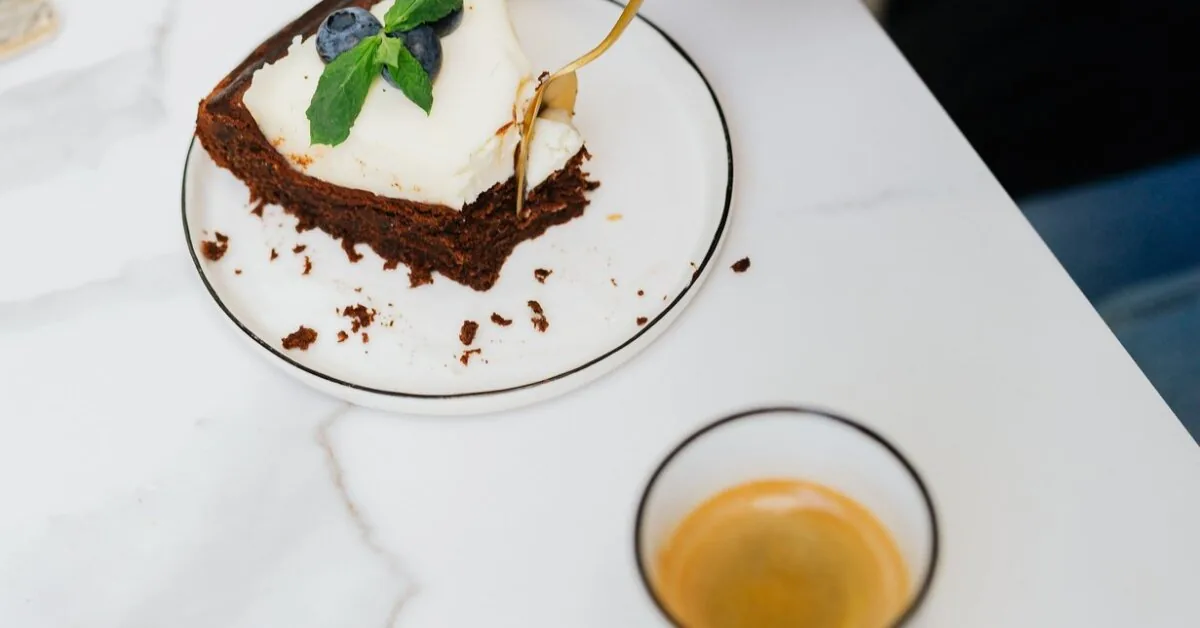 Perfect dessert: moist brownie with a fluffy curd layer and blueberries