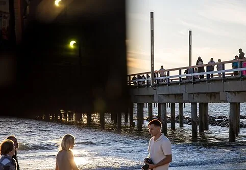 People watch the solar eclipse at the seaside