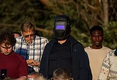 People watch the solar eclipse at the seaside