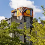 What is an owl doing on the roof of an apartment building in Lazdynai?