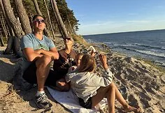 People watch the solar eclipse at the seaside.