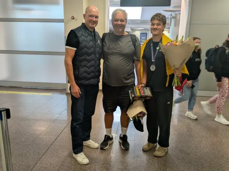 Photo by K. Rimkus / Lithuanian Volleyball Federation President Darius Čerka, coach Tadas Donėla, and silver medalist Dovydas Sinkevičius.