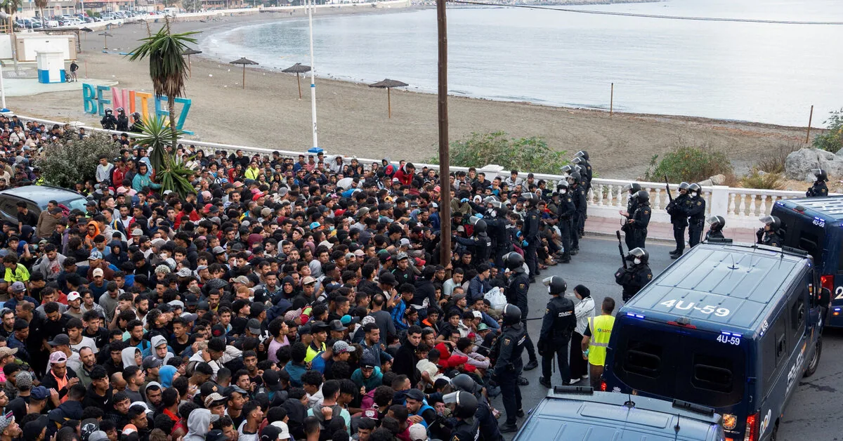 In the Spanish enclave of Ceuta, police are relocating migrants from the beaches