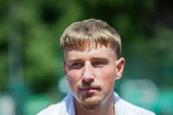 Ed Butvilas, hearing compliments from Serbs, expressed mixed feelings: "Both good and not good"