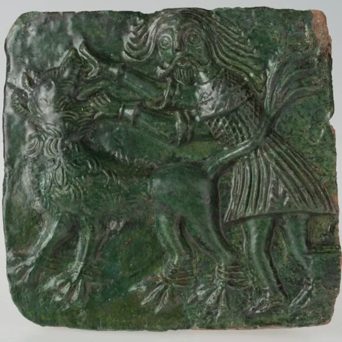 LNM photo / Tile with Samson defeating the lion. 15th century. Museum of the Origins of the Polish State in Gniezno